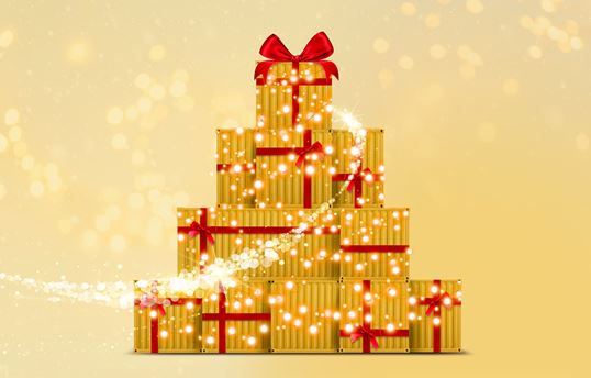 Gold Christmas gifts stacked to form a Christmas tree