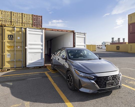 Car being loaded in an MSC container for safe shipping
