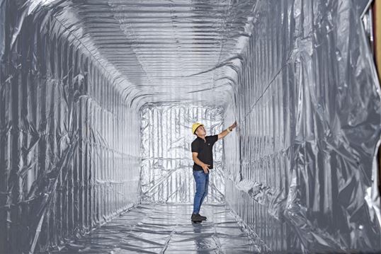 MSC Employee checking the installation of thermal liner