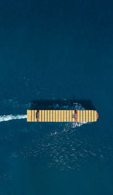MSC Container Vessel view from the top carrying MSC yellow containers while sailing in deep blue sea